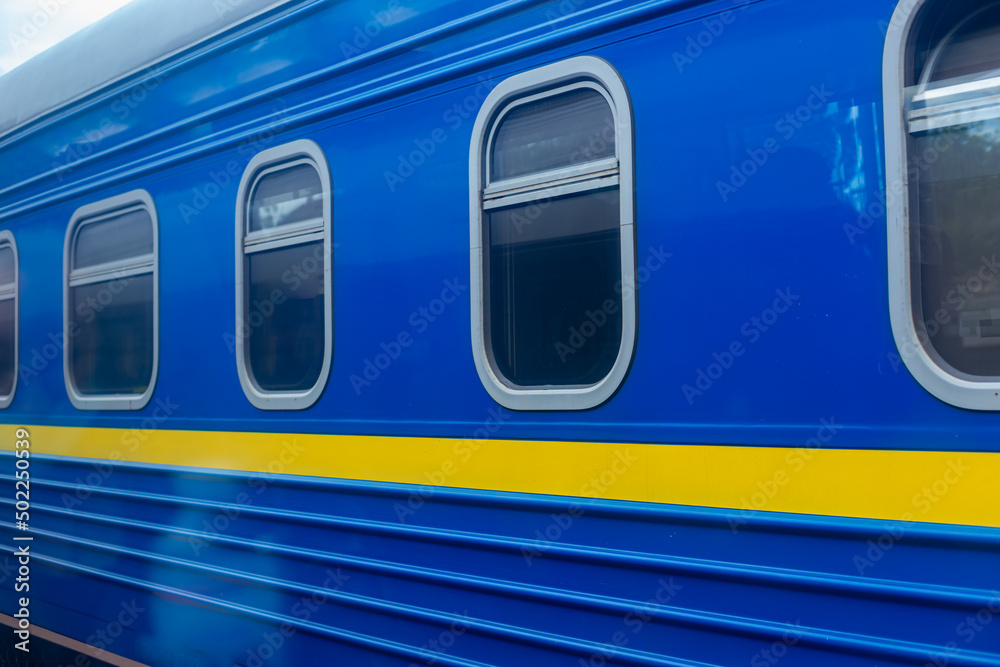 Ukrainian train wagon. Modern electric train locomotive. Fast traveling. Ukrainian refugees transportation.