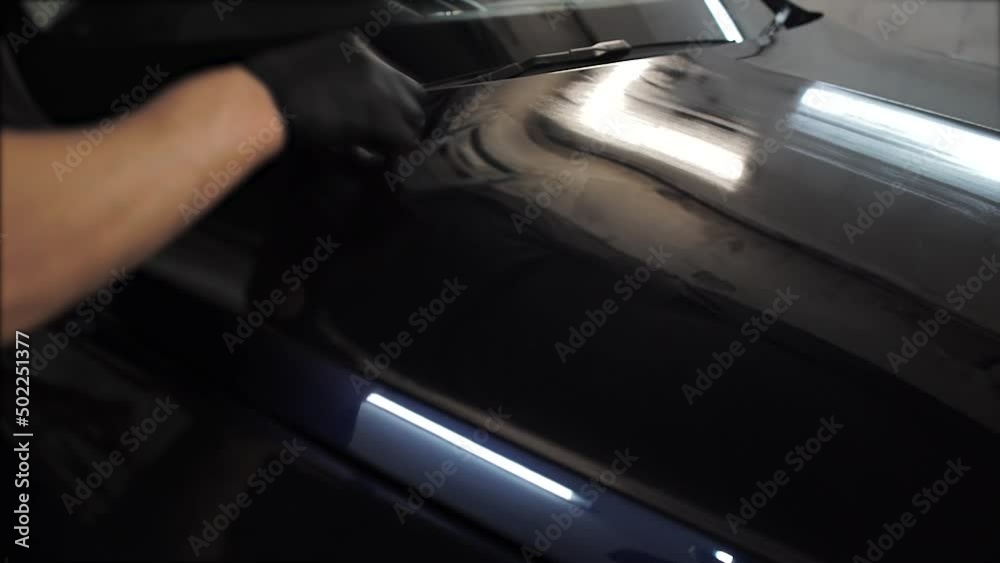 Car wash. Close up of car interior cleaning. Detailing. Polishing car paint. Cleaning the seats. Car wash. Close up of car interior cleaning. Detailing. Polishing car paint. Cleaning the seats.