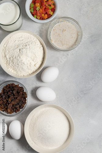 Ingredients for cupcake in bowls on a light background