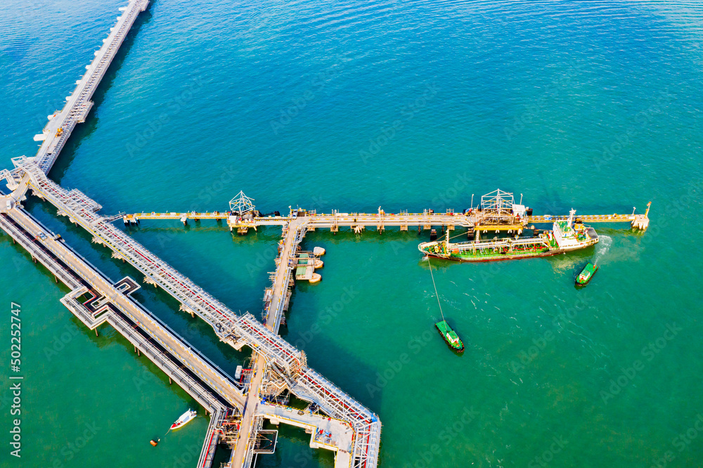 Pipeline for oil delivery ships. oil tanker container ship at sea. Crude oil tanker LPG NGV, Oil tanker ship to Port of Singapore - import-export. Pipeline transport