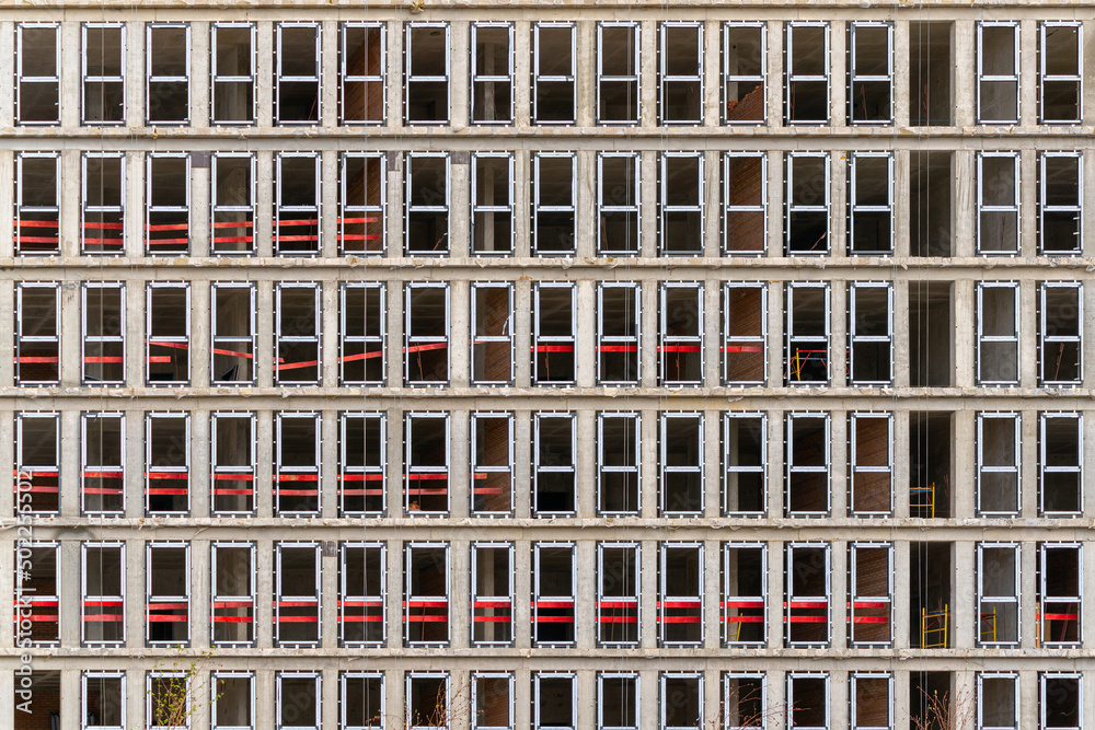 Facade of a house under construction. modern building industry. Sale and rental of real estate. Facade of a house under construction. modern building industry. Sale and rental of real estate.