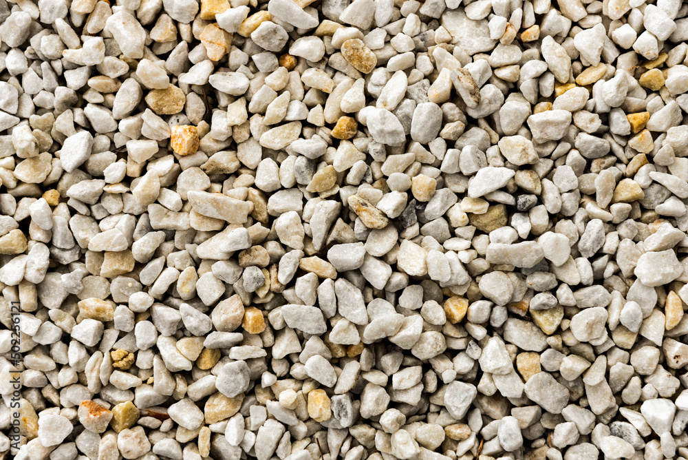 Background of small white sea stones. rocky surface Background of small white sea stones. rocky surface