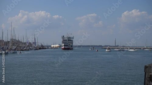 the port of Cowes on the Isle of Wight, UK.  Ferry arriving in the harbour photo