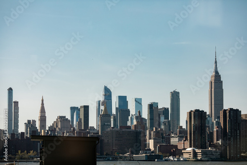 Empire State Building and Manhattan Skyline against a clear blue sky