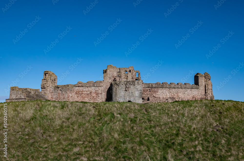 Tantallon Castle walls under clear blue sky