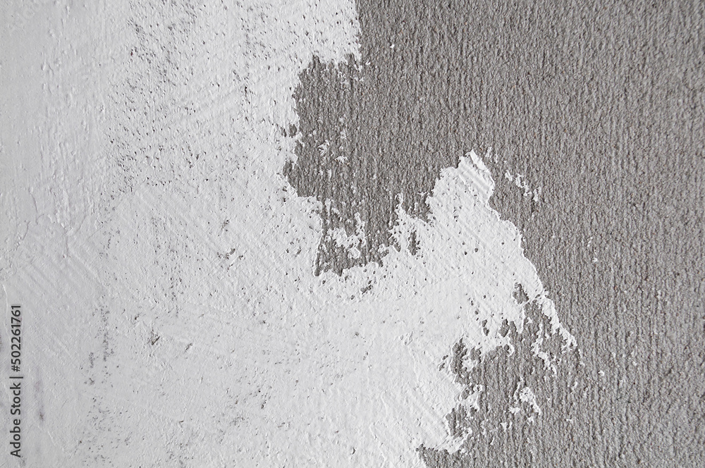 Wall painted white color on concrete. Wall concrete texture and splash brush or abstract background.