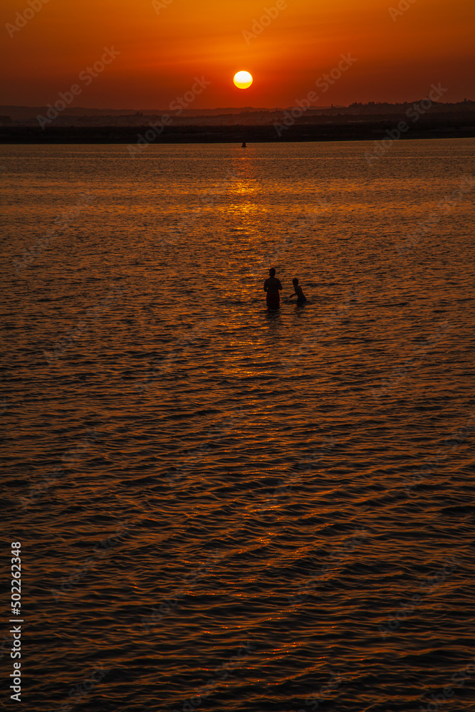 Long shot of a sunset at the beach Long shot of a sunset at the beach