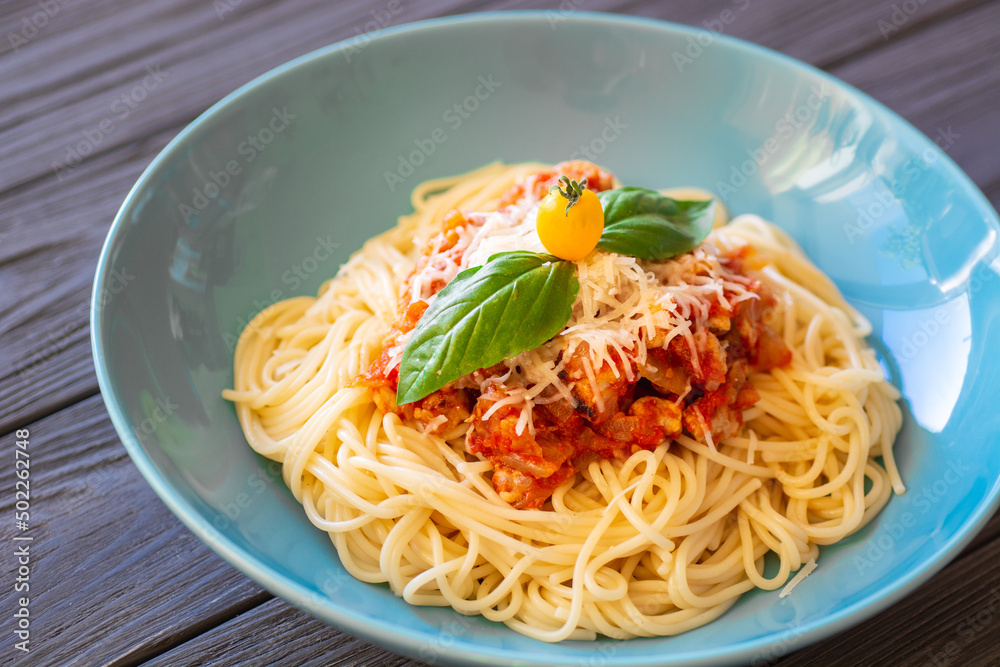 delicious spaghetti dish with meat sauce and parmesan cheese