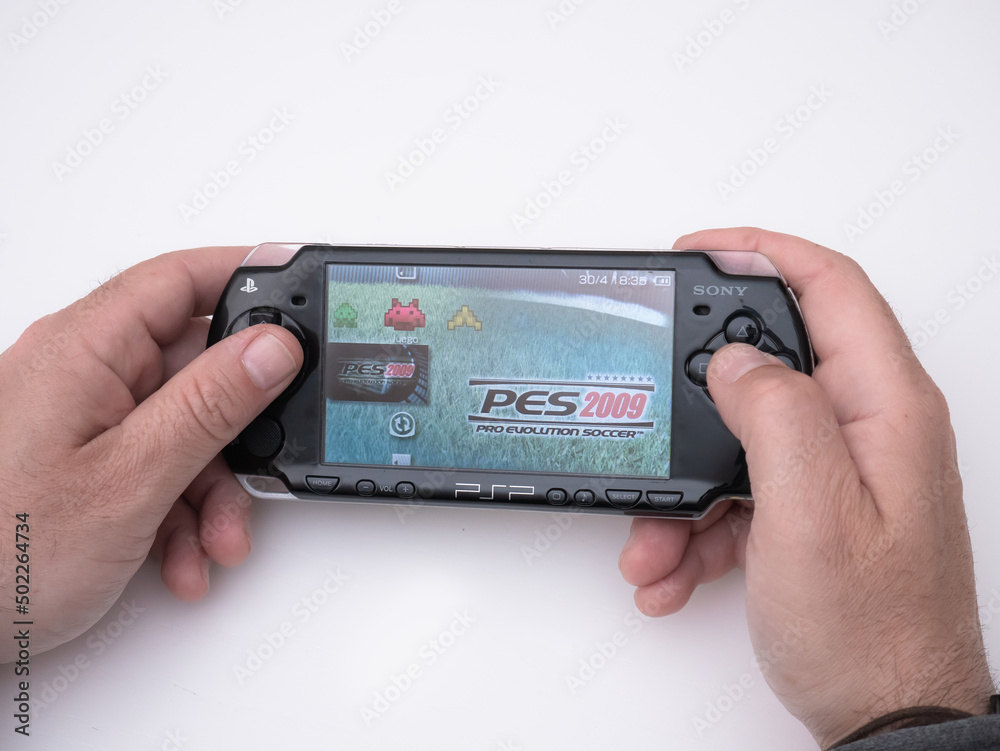 Young man holds in his hands the famous black Sony PSP (Playstation  Portable) video game console to start play Stock Photo | Adobe Stock