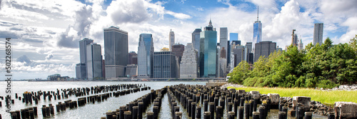 Tableau sur toile New York City Skyline panoramic banner showing Midtown and Lower Manhattan from the Brooklyn Bridge Park Pier 1 salt marsh