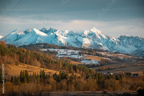 Snowy Tatra mountains in the rays of sunset.