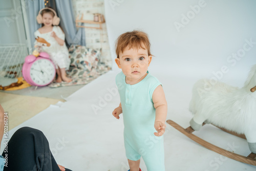 little boy on white background girl with pink alarm clock