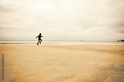 Person running on beach