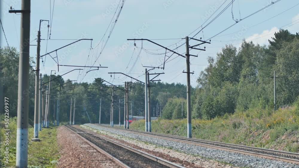 A passenger train arrives at the station. A passenger train arrives at the station.