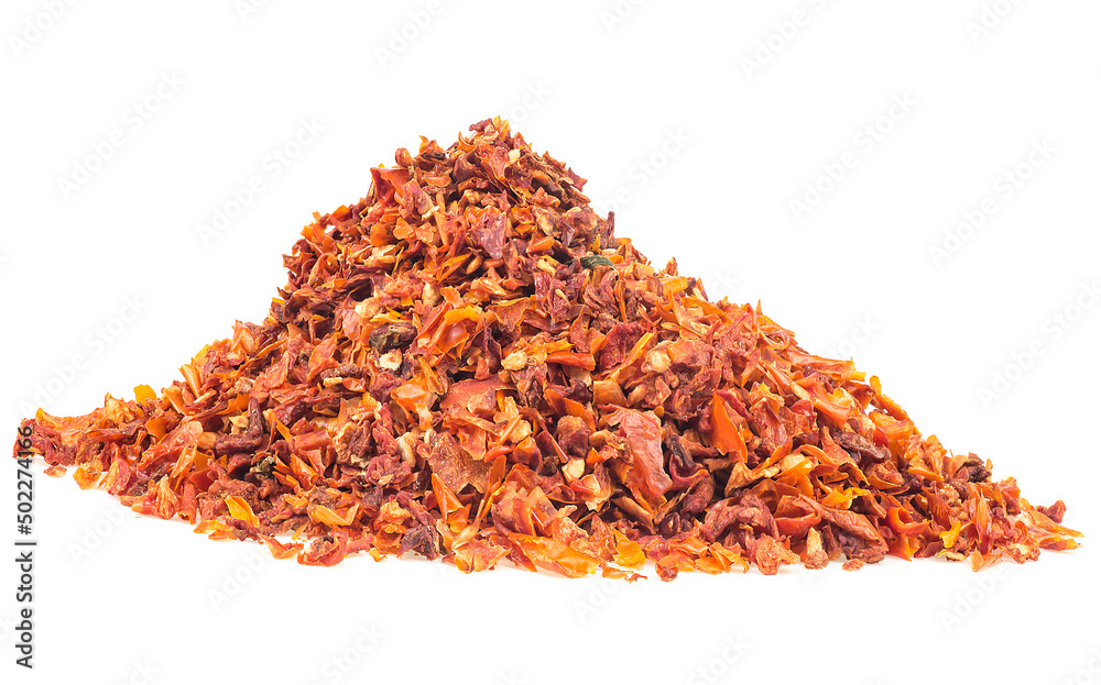 Pile of dried and chopped tomatoes isolated on a white background. Tomato flakes. Pile of dried and chopped tomatoes isolated on a white background. Tomato flakes.