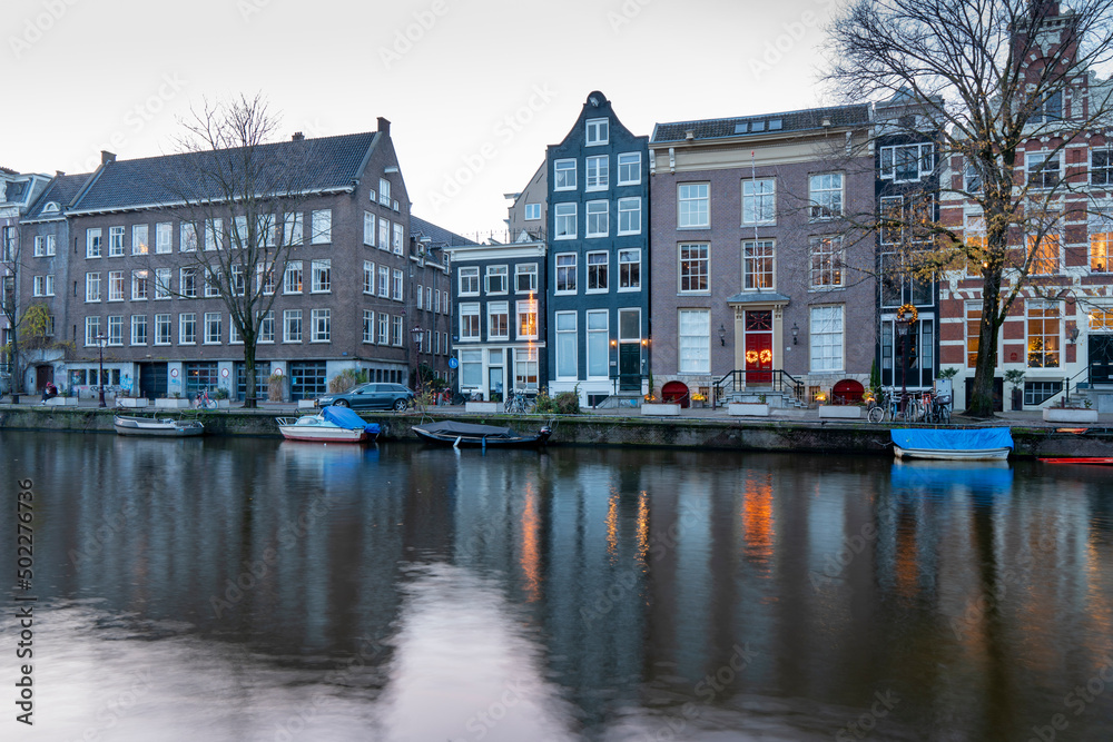 Amsterdam Holland Netherlands on December 11, 2021: Houses by the canal  in winter