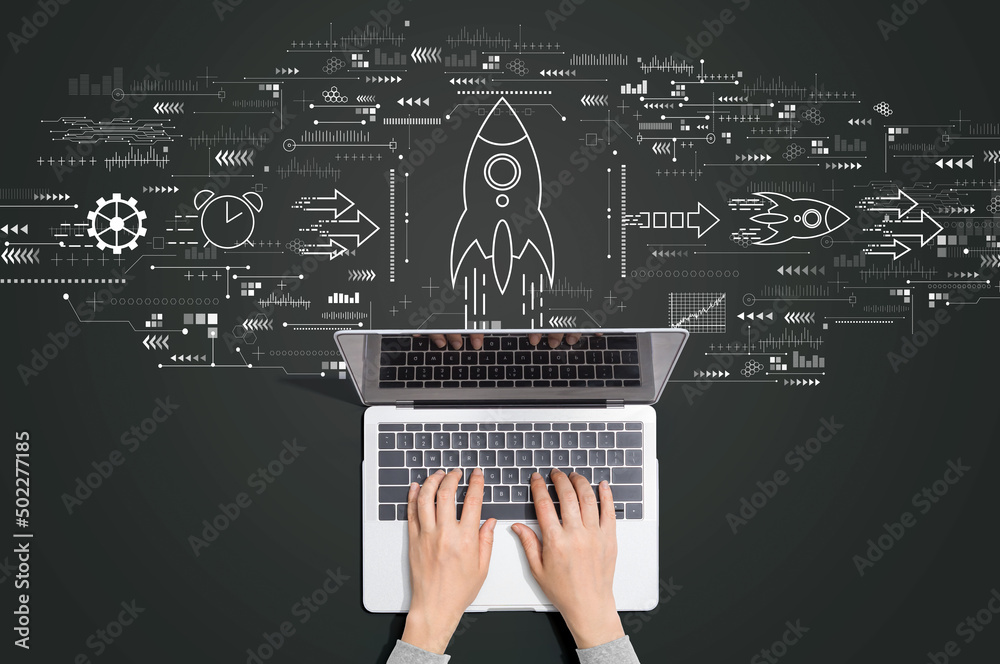 Rapid growth concept with person using a laptop computer - obrazy, fototapety, plakaty 