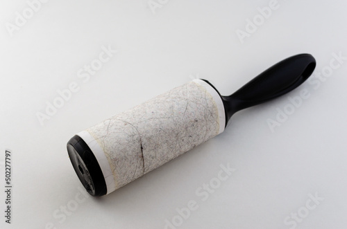 Close-up front view of a used fabric sicky roller