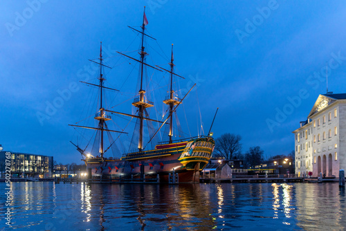 Wallpaper Mural Amsterdam Netherlands on December 13, 2021: City scenic from Amsterdam at the Amstel in the Netherlands at night. Amsterdam Light Festival Boat Tour in Christmas. Torontodigital.ca