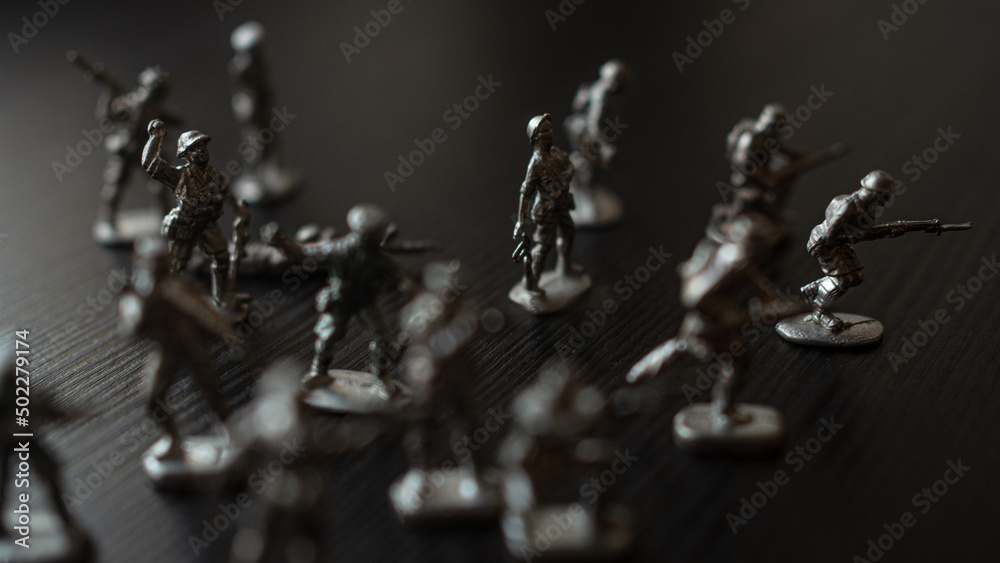 The concept of war and confrontation, political crises, toy tin soldiers attacking each other