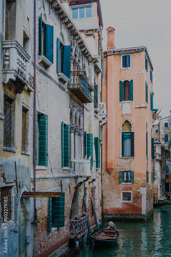 Canal streets with gondolas and boats in Venice, Italy