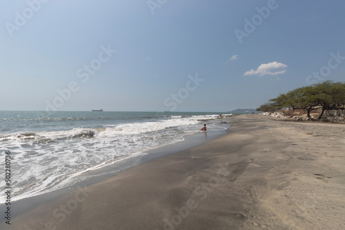 Santa Marta city airport beach at midday with clear blue sky