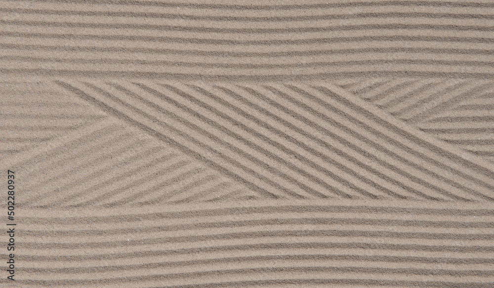 Obraz premium Zen pattern in sand as background,Zen concept