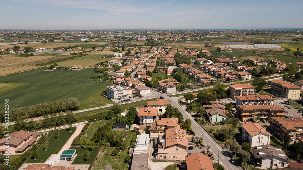 Aerial drone view of green fields and farmland in rural Italy
