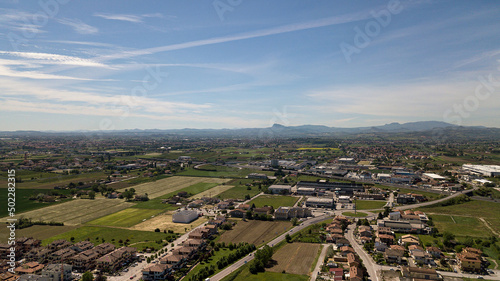 Aerial drone view of green fields and farmland in rural Italy