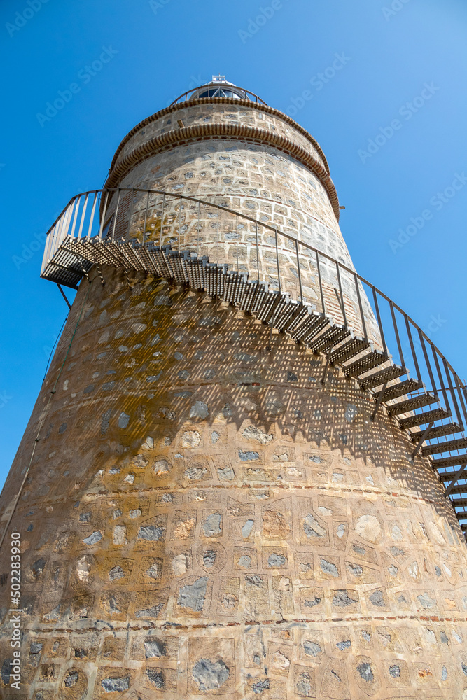 Low angle view of La Herradura lighthouse in Almuñécar (Spain)