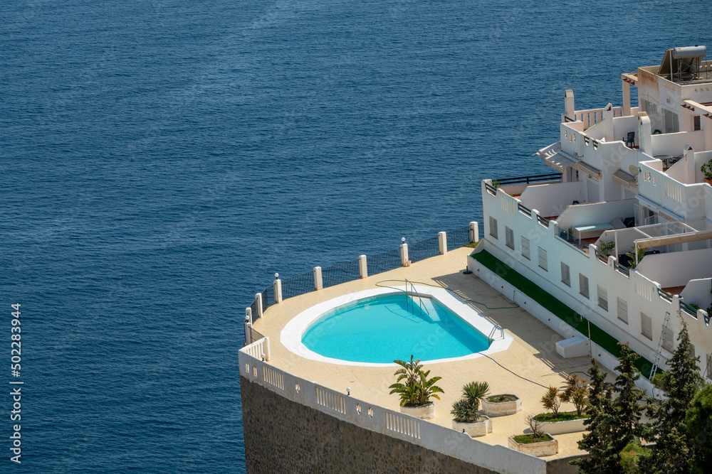 Pool on the edge of a cliff overlooking the sea
