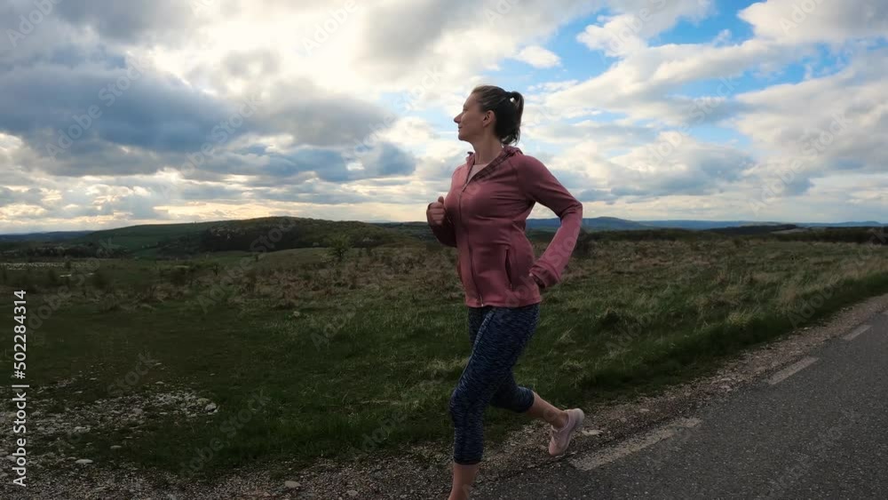 woman jogging on hills sports and active lifestyle woman jogging on hills sports and active lifestyle