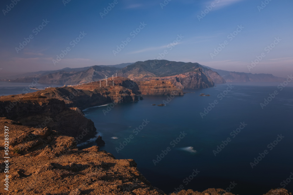 Point of Saint Lawrence - the easternmost point of the Portugese island of Madeira. The headland is a nature reserve - stuning rock formations with blue waters around. October 2021. Long exposure shot