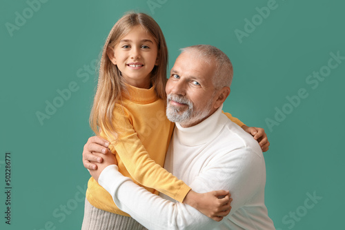 Little girl with her grandf...