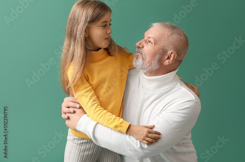 Little girl with her grandf...
