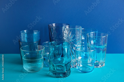 Stylish empty glasses on bl...