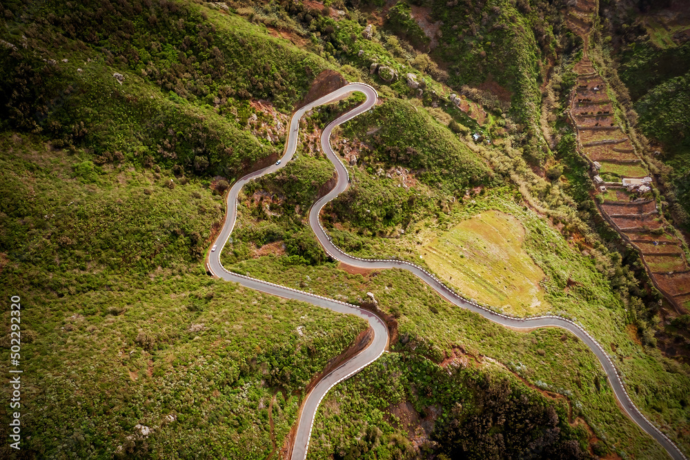 Curvy mountain road on the green part of Tenerife island, Spain Curvy mountain road on the green part of Tenerife island, Spain