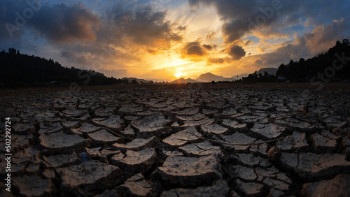 Fotografia, Obraz Earth Crack Landscape with sunset sky