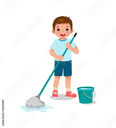 Happy little boy holding mop and bucket cleaning floor doing housework chore