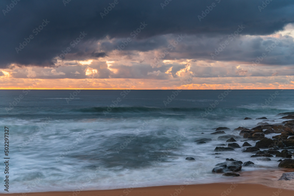 Dawn seascape with rain clouds