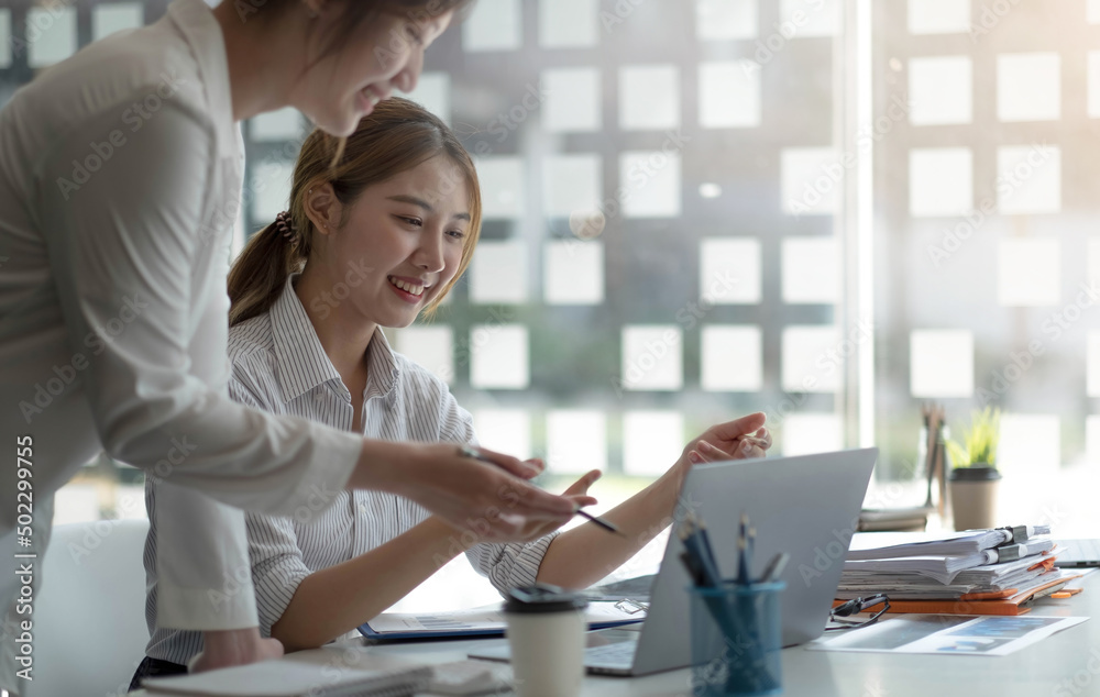 Two beautiful young asian businesswoman working together using digital tablet at office. Two beautiful young asian businesswoman working together using digital tablet at office.