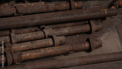 Stack of iron pipes at construction site