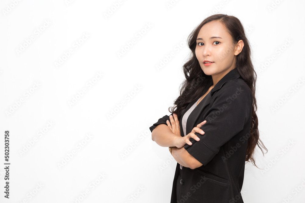 Beautiful Asian business woman wearing black suit with her crossed arms on white background and copy space. Confident Asian working woman smiling and cheerful Beautiful Asian business woman wearing black suit with her crossed arms on white background and copy space. Confident Asian working woman smiling and cheerful