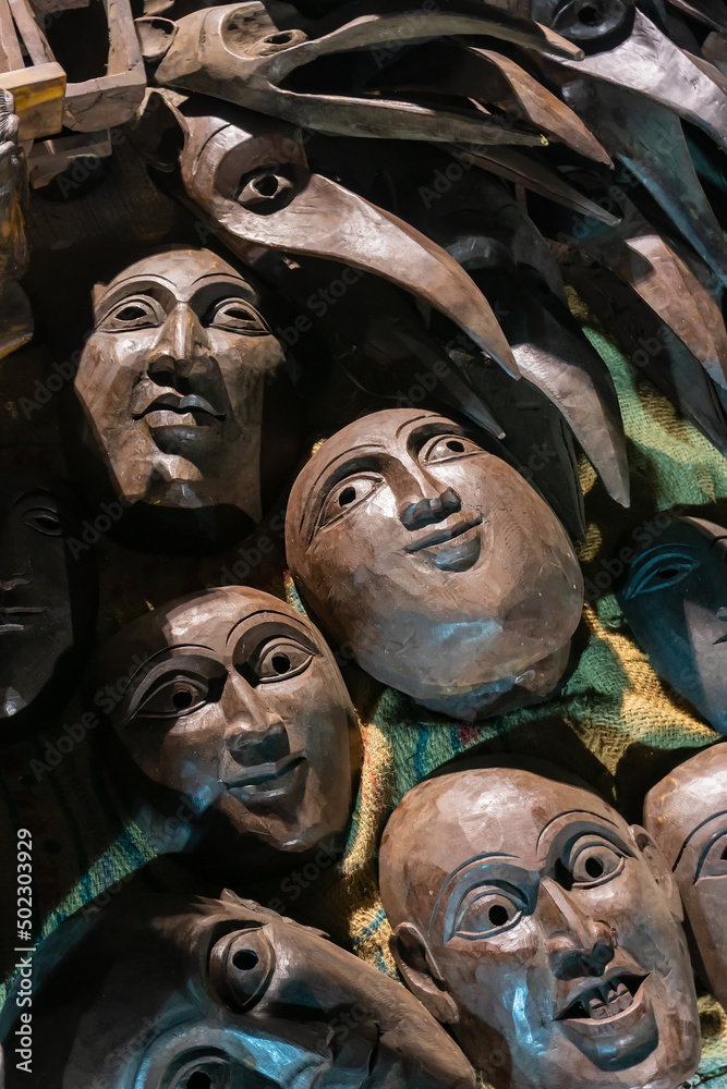 Brown color clay made masks, Terracotta masks, made in Krishnanagar, Nadia, West Bengal, for sale in Handicraft Fair in Kolkata. Biggest handicraft fair in Asia.