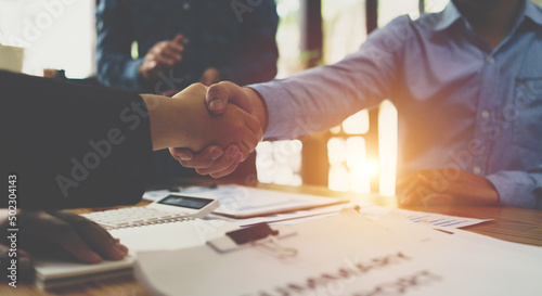 Fotografie Business people shaking hands in office