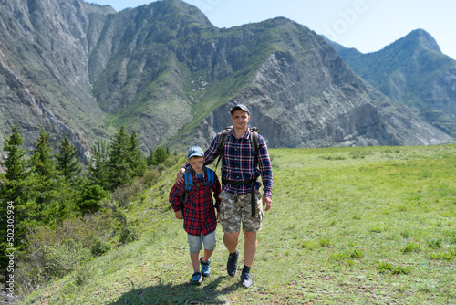 Father and son hiking in the mountains © avtk