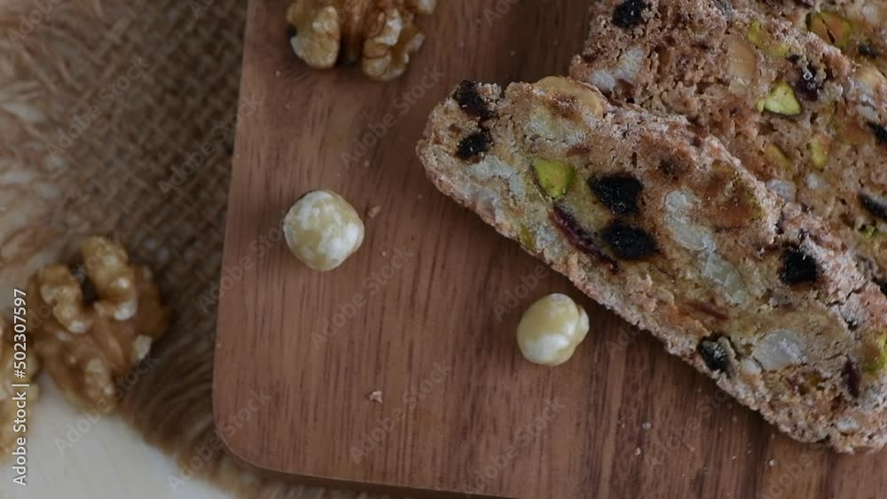 biscotti on wood plate, home made bakery and healthy food concept, Rotation shot and slow motion biscotti on wood plate, home made bakery and healthy food concept, Rotation shot and slow motion