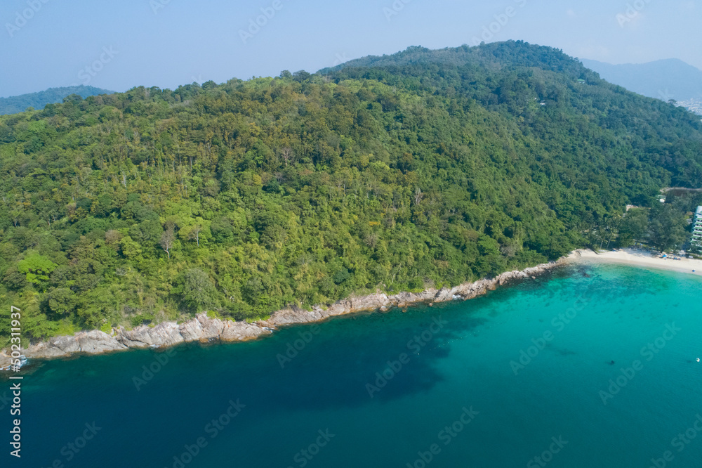 Amazing top view seashore Aerial view of Tropical beach sea in the beautiful Phuket island. Beautiful ocean beach at Phuket Thailand