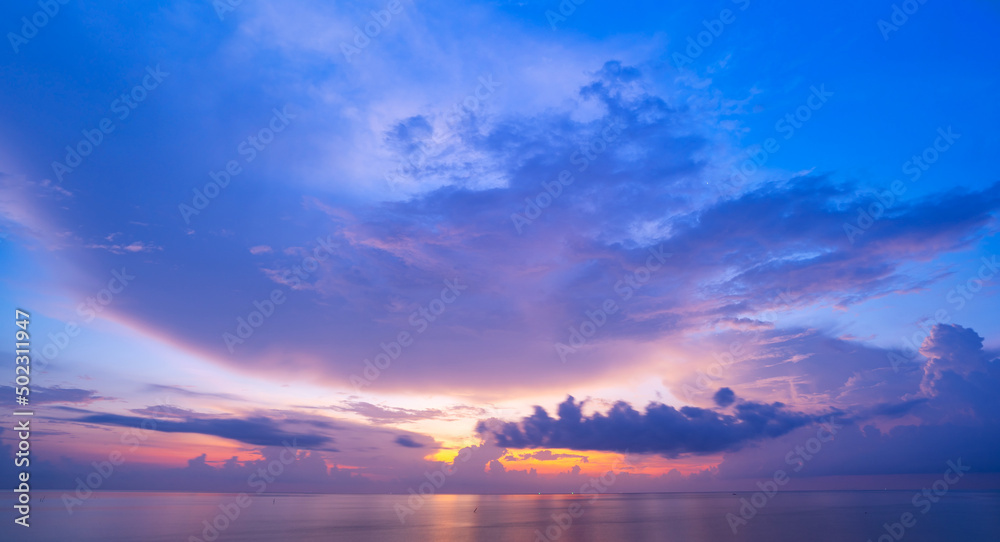 Sunset or sunrise sky clouds over sea sunlight in Phuket Thailand Amazing nature landscape seascape background