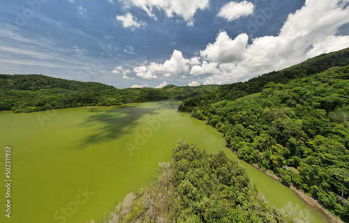 Panorama landscape nature lake or pond Aerial view drone shot of scenery mountain green tropical rainforest and blue sky in phuket thailand